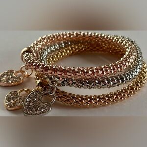 Chic stainless steel heart charm stretch bracelets in a beautiful mixed trio
